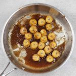 Fried bananas in a frying pan.
