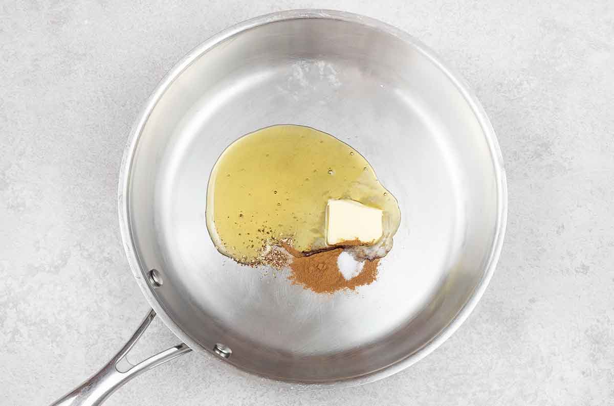 Honey, butter, cinnamon, salt and nutmeg in a large frying pan.