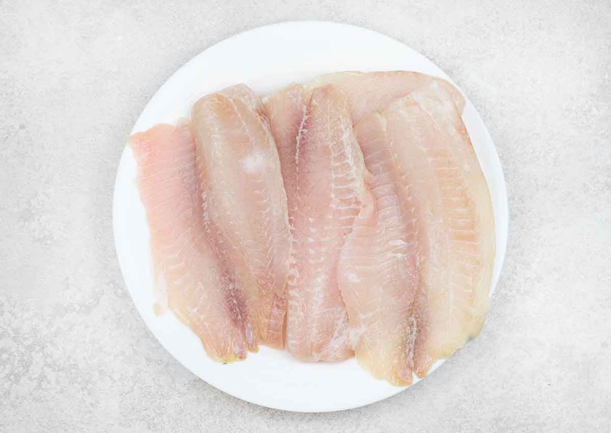 Tilapia fillets seasoned with salt.