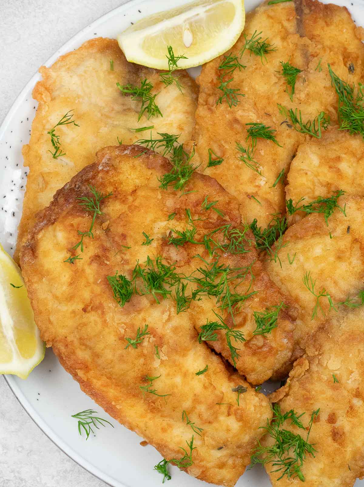 Fried tilapia in a serving plate.