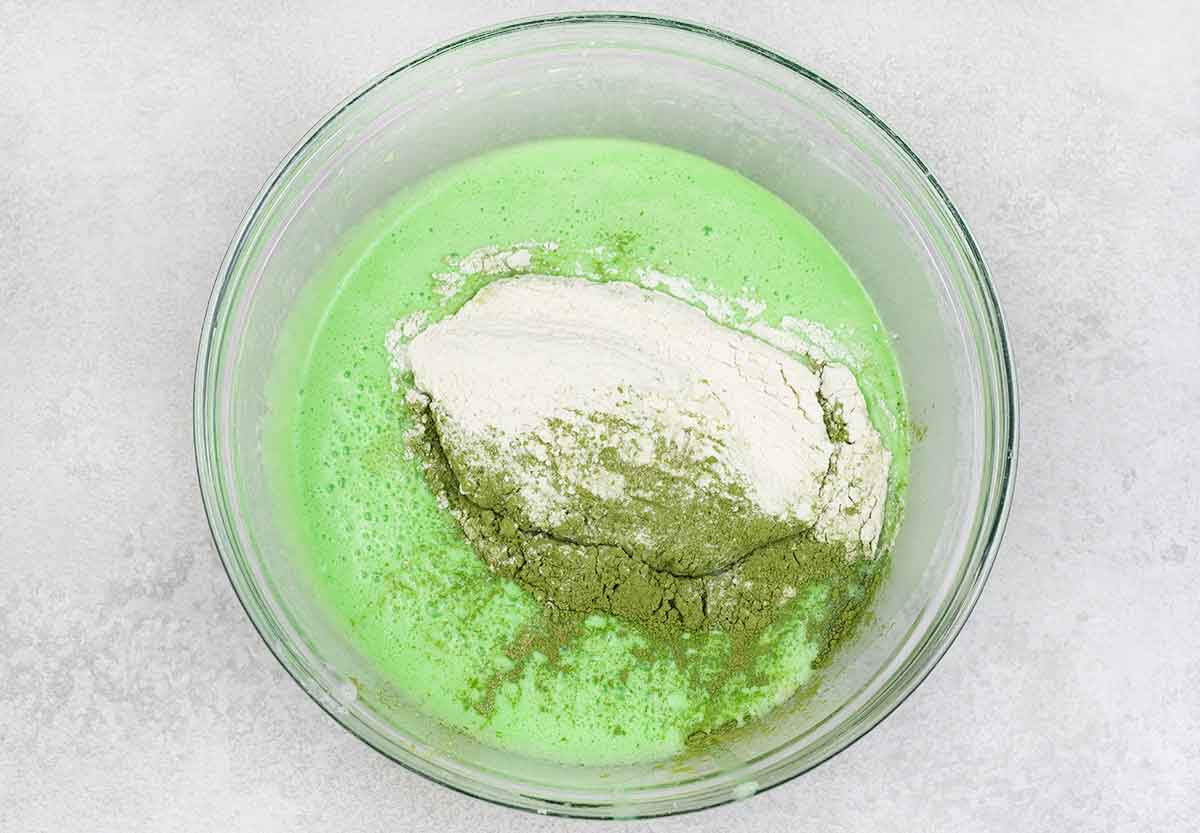 Flour and matcha powder added to the mixture.