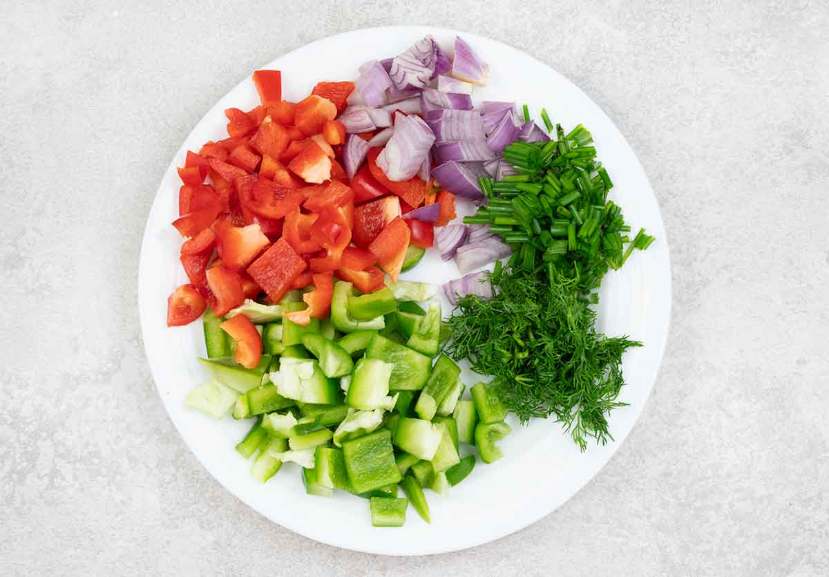 Chopped bell pepper, onion, dill and chives.
