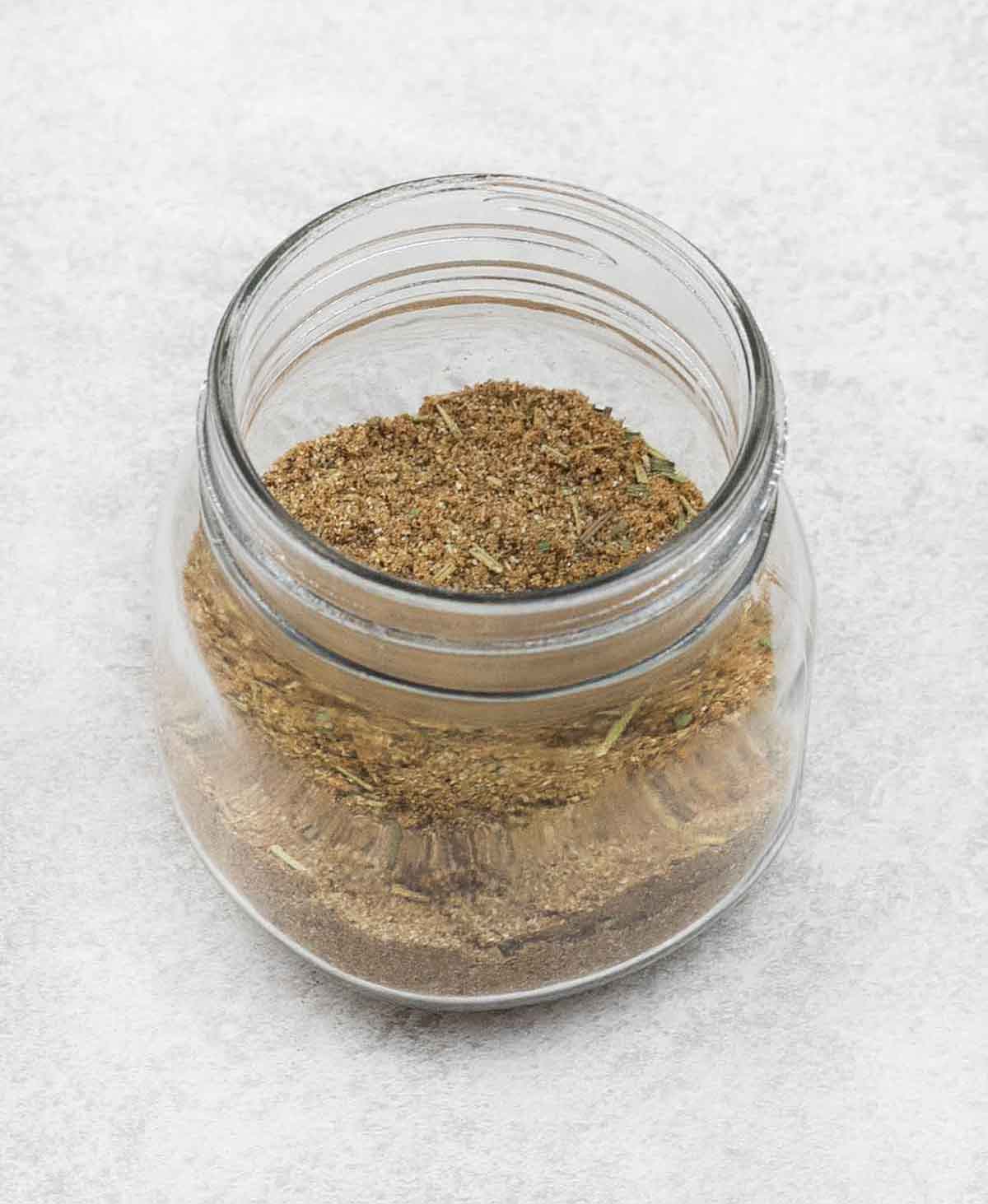 Fish spice mix in a glass jar.