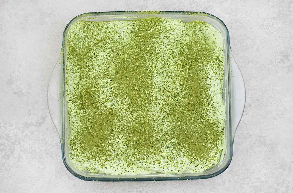 sprinkle matcha powder over the tiramisu.