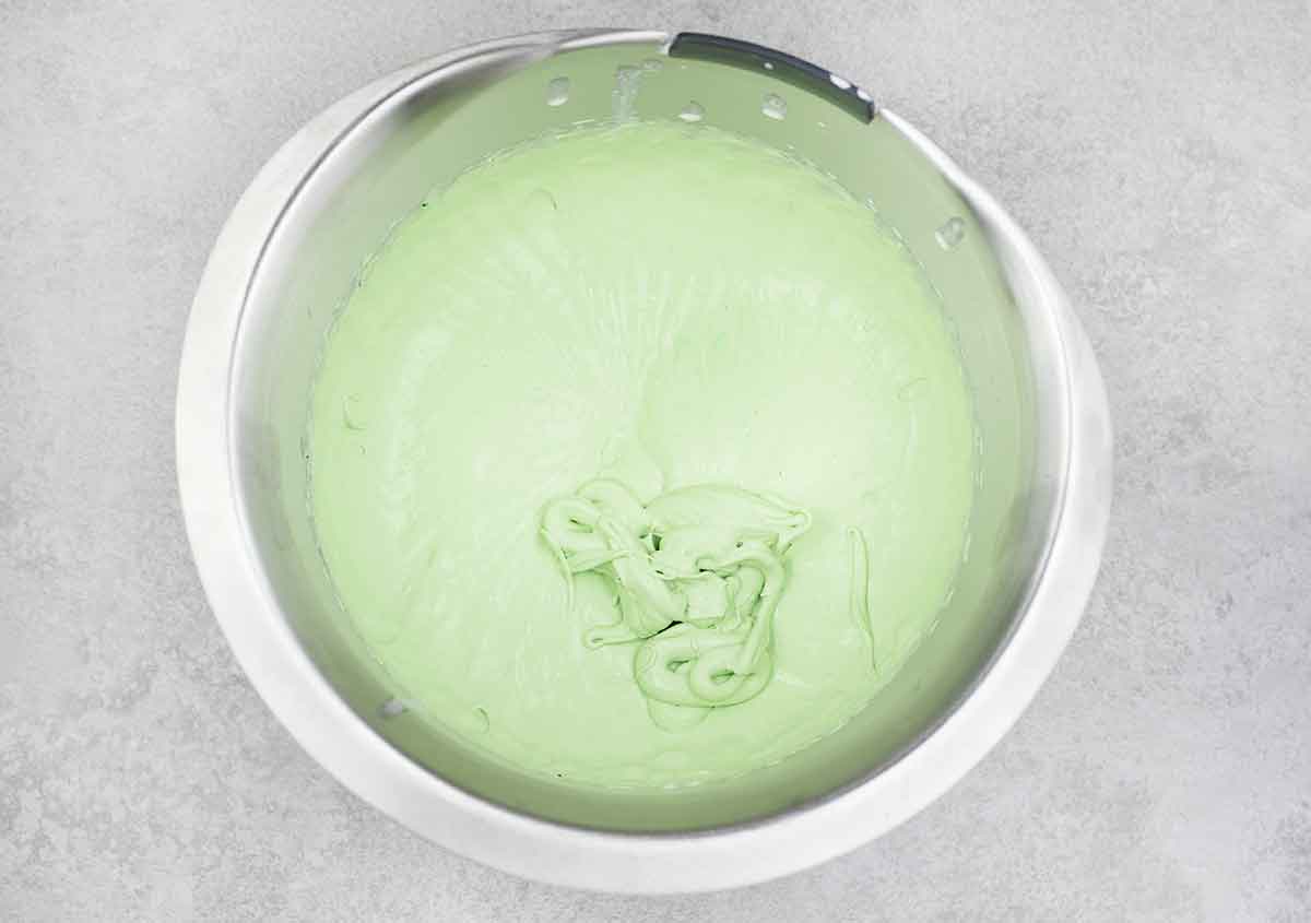 whipped heavy cream, sugar, matcha powder, and pandan extract until soft peaks form.