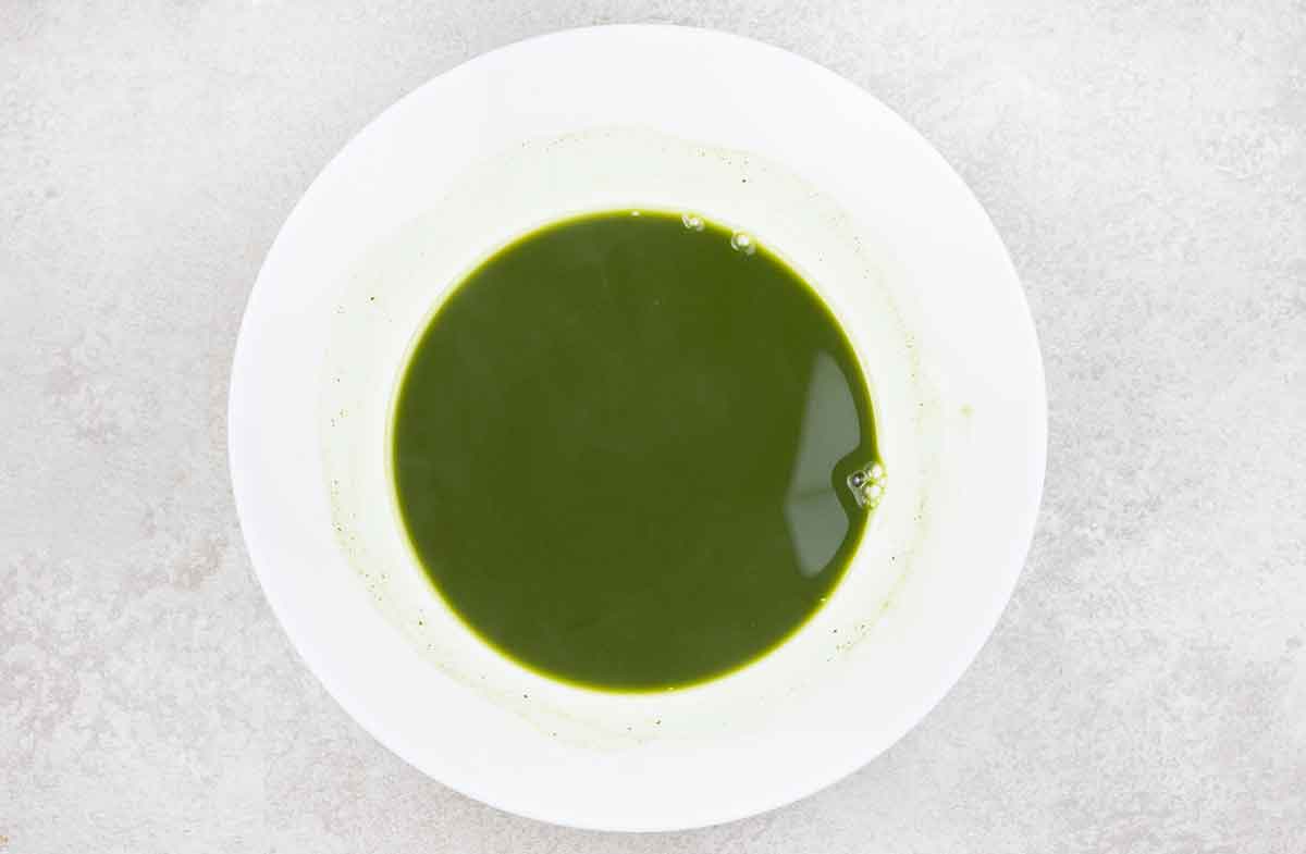 hot water mixed with matcha powder, and caster sugar until the sugar has dissolved.