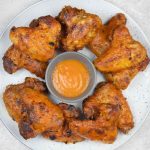 Crispy mango pepper wings served with dipping sauce.